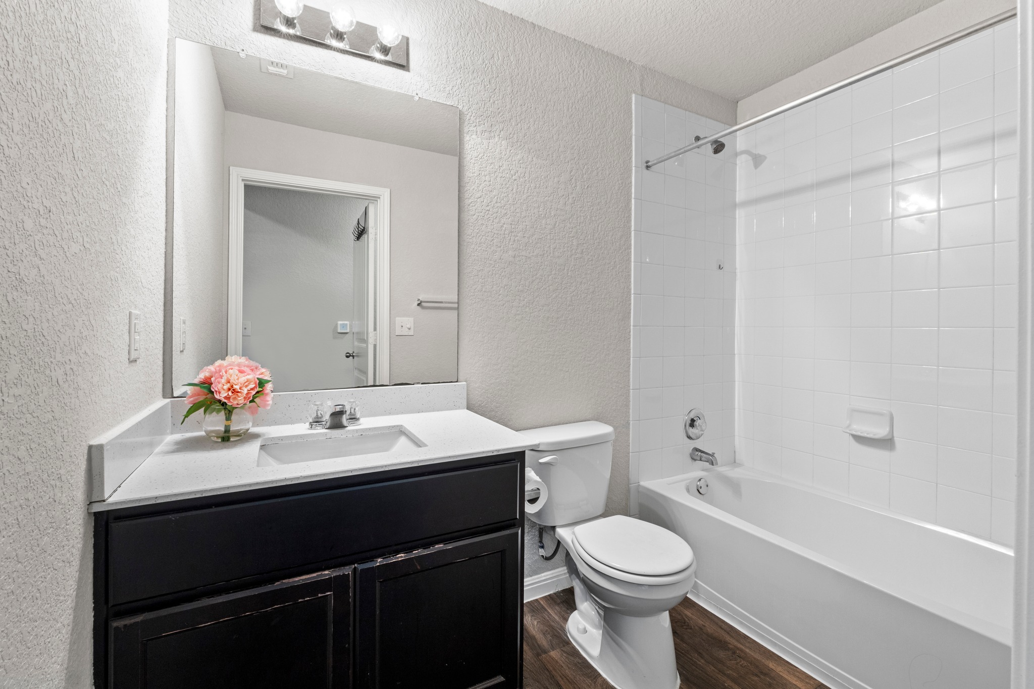 10809 Gonzales Ranger Pass Austin, TX 78754 - Photo 28 of 37 The full secondary bathroom comes with a shower/tub combo.