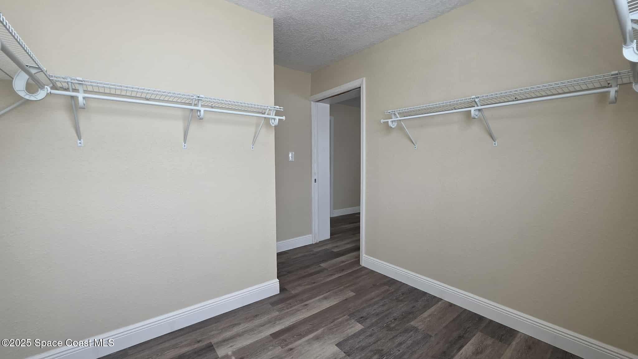 410 4th Street Merritt Island, FL 32953 - Photo 21 of 37 a view of an empty walk in closet