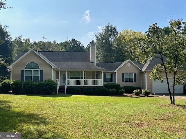 283 Covington Road Griffin, GA 30223 - Photo 1 of 1 a front view of a house with garden