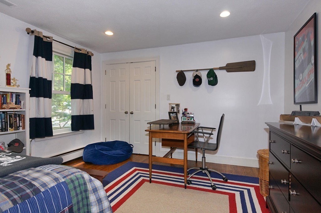 8 Tamarack Road Weston, MA 02493 - Photo 12 of 23 a bedroom with furniture and a fireplace