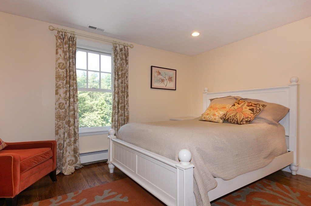 8 Tamarack Road Weston, MA 02493 - Photo 13 of 23 a bedroom with a bed and a couch
