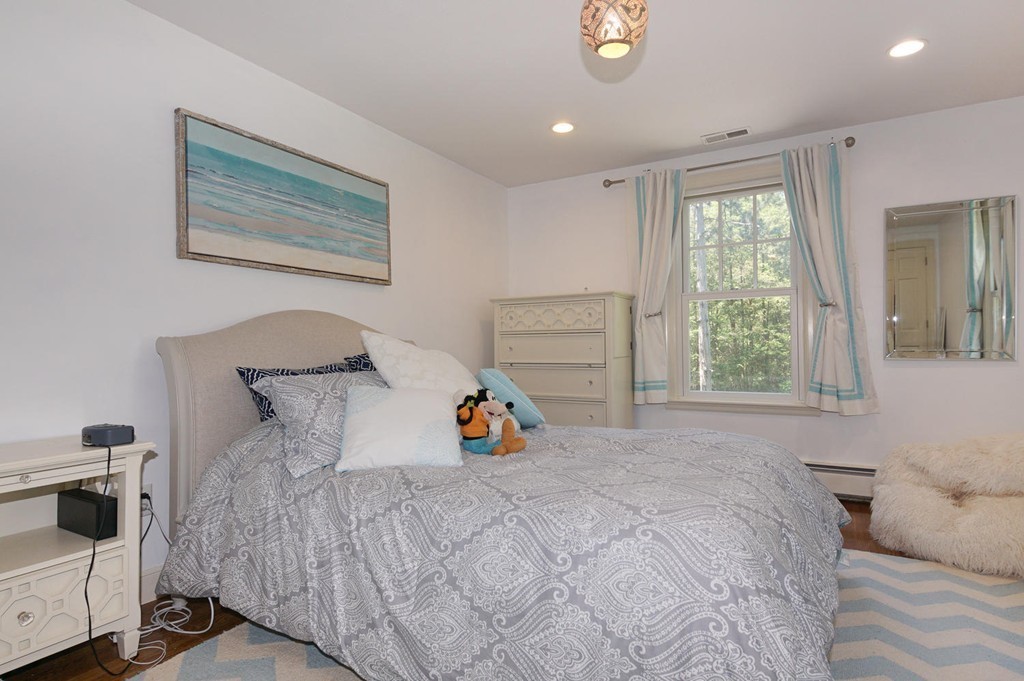 8 Tamarack Road Weston, MA 02493 - Photo 14 of 23 a bedroom with a bed and a window