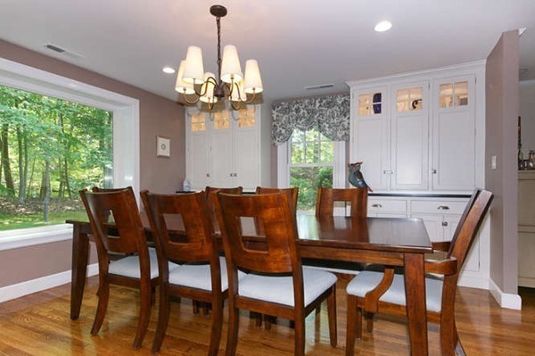 8 Tamarack Road Weston, MA 02493 - Photo 5 of 23 a dining room with furniture a chandelier and window