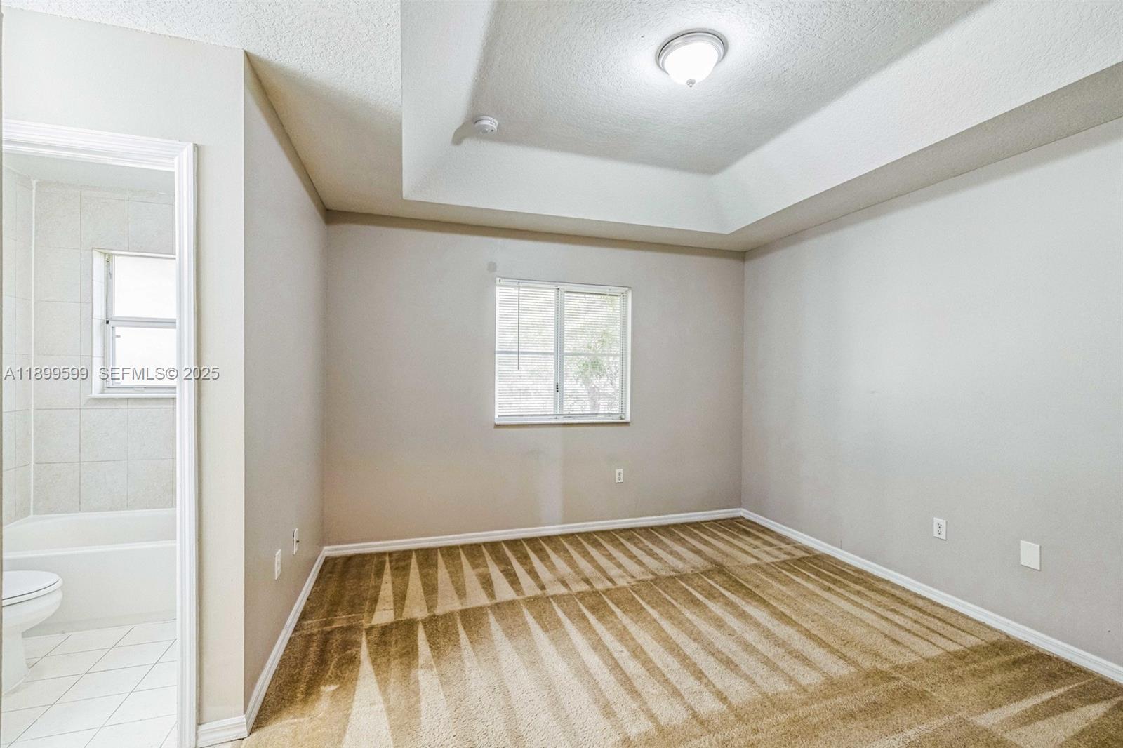 1655 Southeast 30th Street Homestead, FL 33035 - Photo 12 of 17 a view of a room with wooden floor and window
