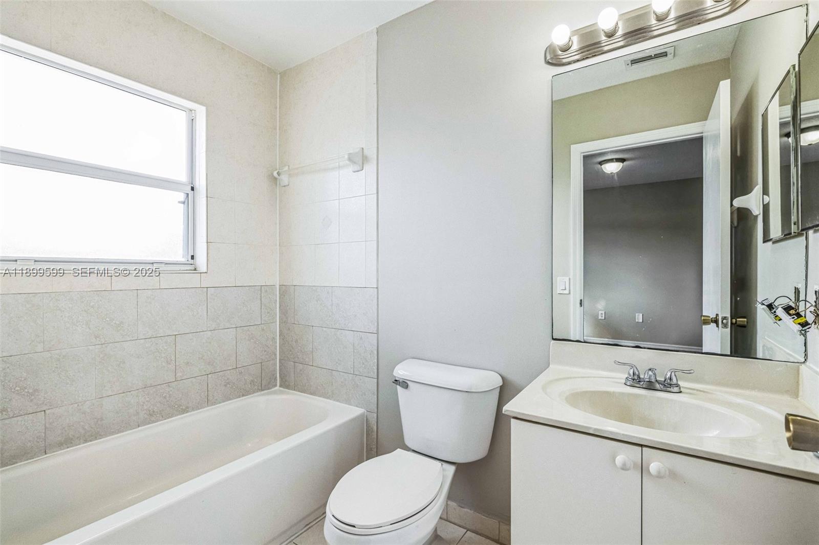 1655 Southeast 30th Street Homestead, FL 33035 - Photo 13 of 17 a bathroom with a toilet a sink and bathtub