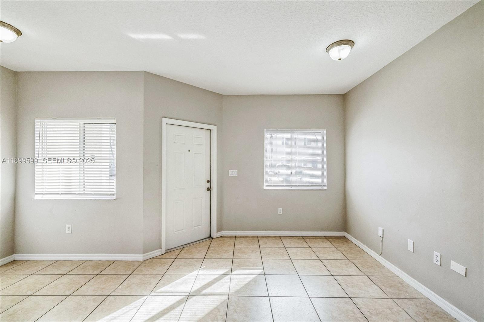 1655 Southeast 30th Street Homestead, FL 33035 - Photo 15 of 17 a view of an empty room and window