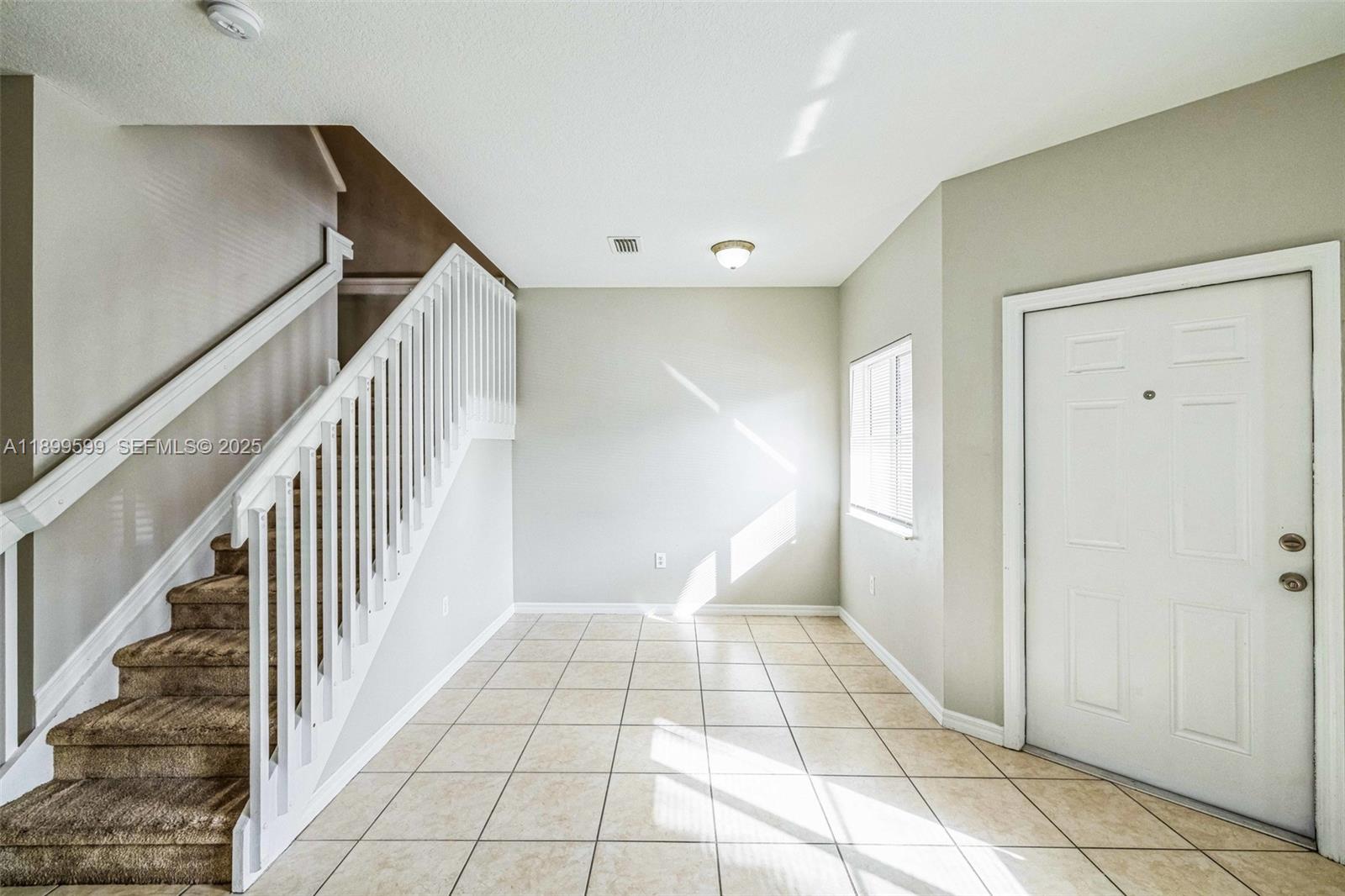 1655 Southeast 30th Street Homestead, FL 33035 - Photo 16 of 17 a view of entryway with stairs