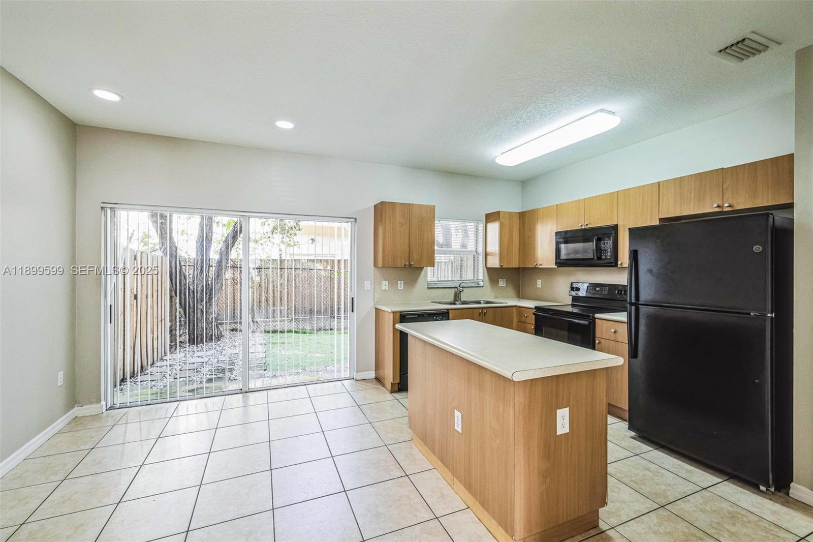 1655 Southeast 30th Street Homestead, FL 33035 - Photo 5 of 17 a large kitchen with a large counter top stainless steel appliances and cabinets