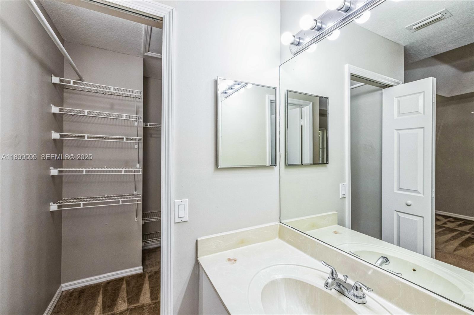 1655 Southeast 30th Street Homestead, FL 33035 - Photo 8 of 17 a bathroom with a sink and a mirror
