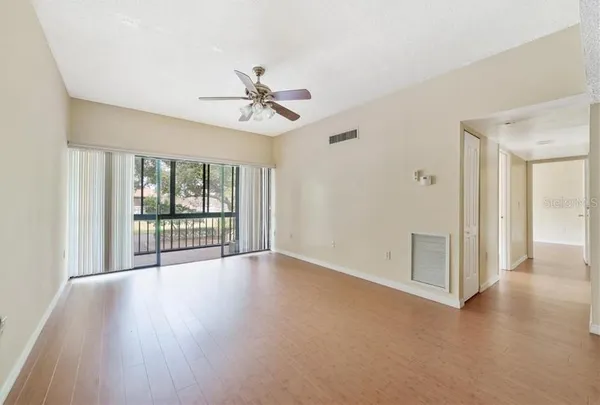 a view of an empty room with a window