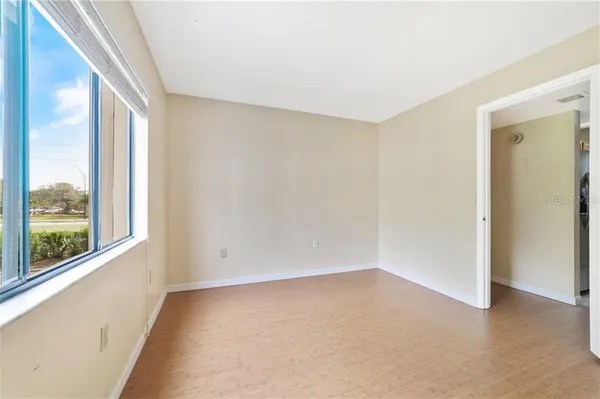 a view of an empty room with a window