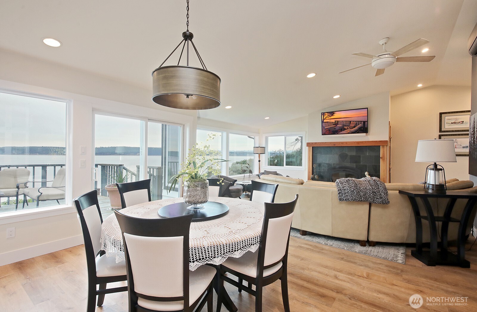 2999 Saratoga Road Langley, WA 98260 - Photo 12 of 40 a dining room with furniture window and wooden floor