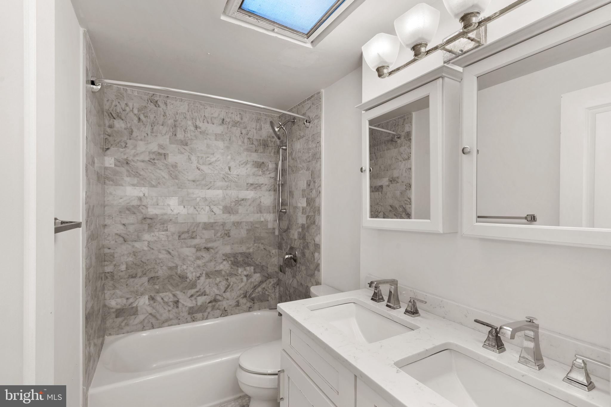 3134 Holly Road Philadelphia, PA 19154 - Photo 13 of 35 Full hall bath with tub shower and double vanity