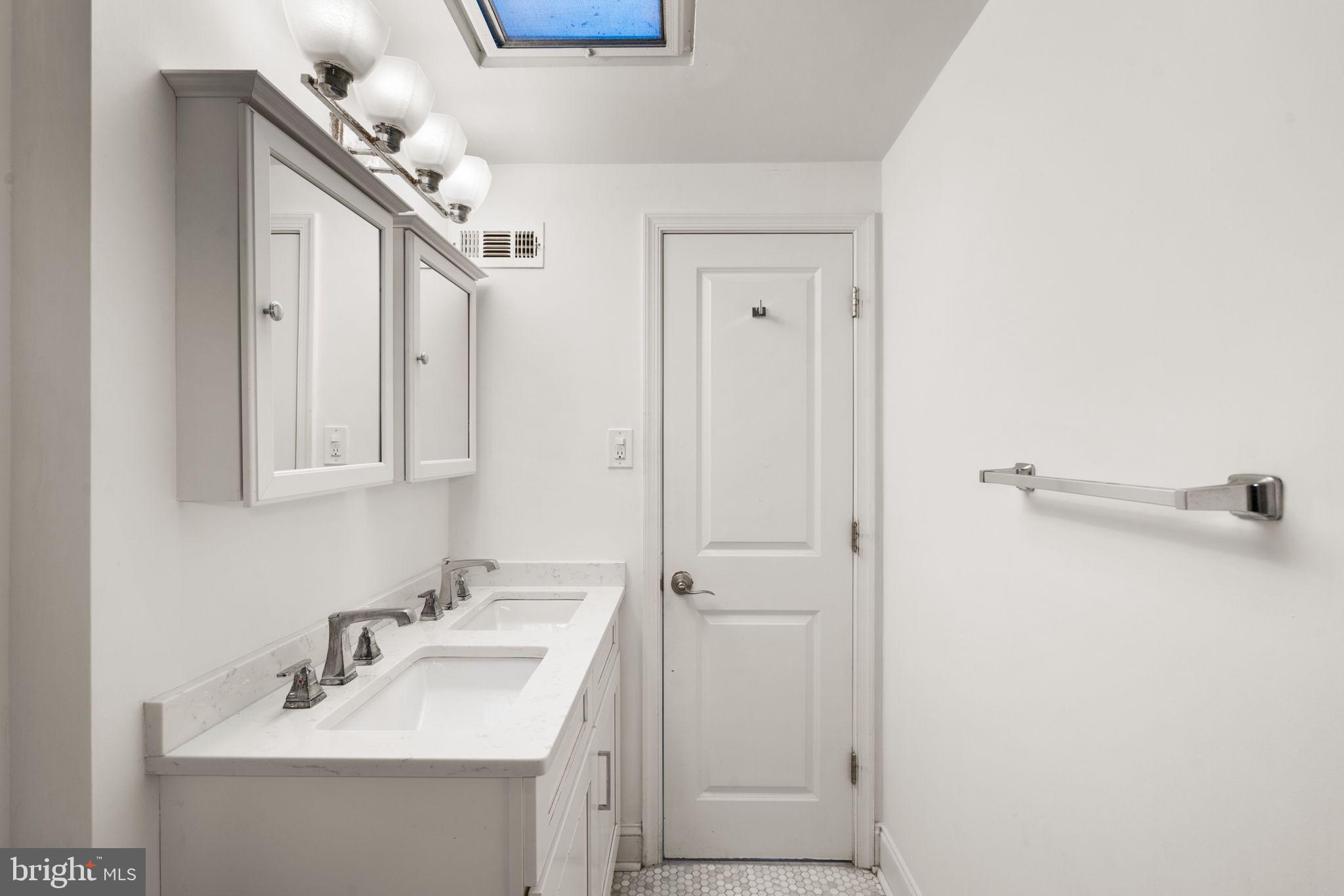 3134 Holly Road Philadelphia, PA 19154 - Photo 14 of 35 Full hall bath with tub shower and double vanity