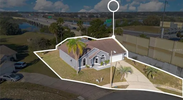 a view of roof deck with table and chairs