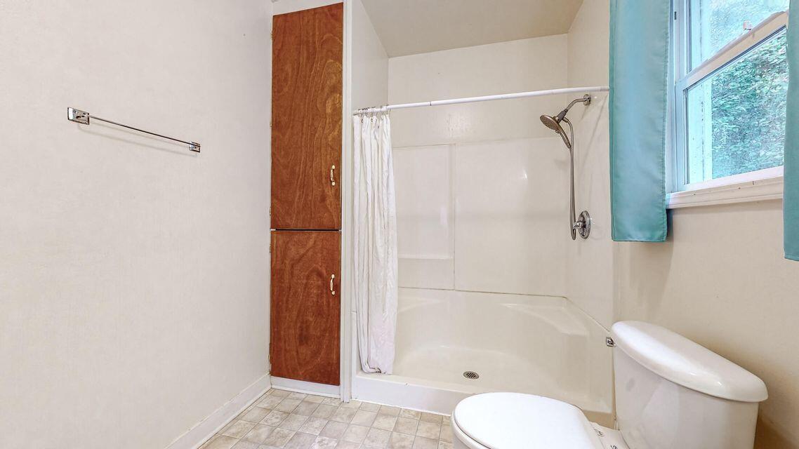 111 Monument Road Rio Dell, CA 95562 - Photo 17 of 26 a bathroom with a shower and toilet