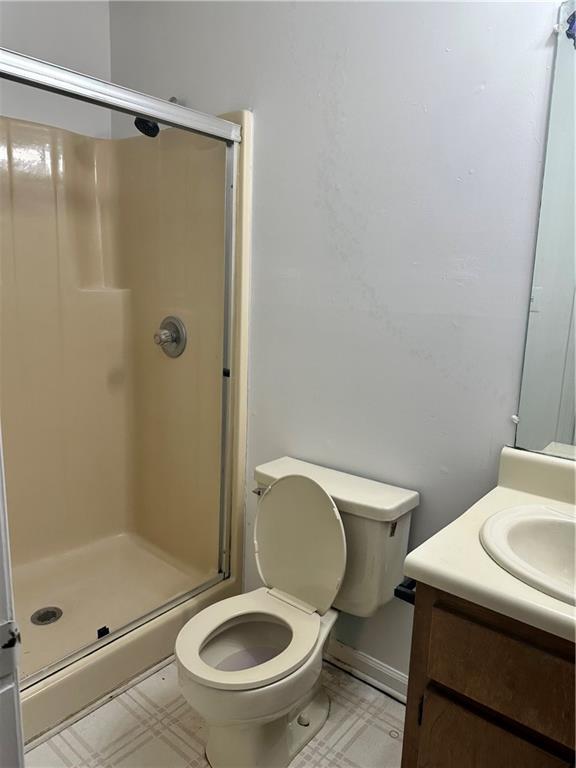 108 Rips Road Calhoun, GA 30701 - Photo 11 of 14 a white toilet sitting next to a tub