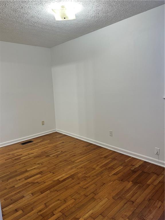 108 Rips Road Calhoun, GA 30701 - Photo 10 of 14 a view of an empty room with wooden floor