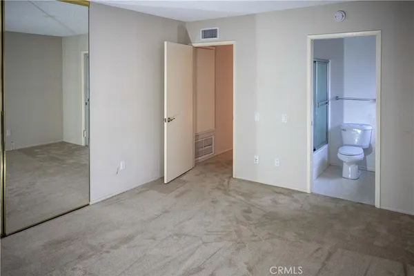 a view of a bathroom from a hallway