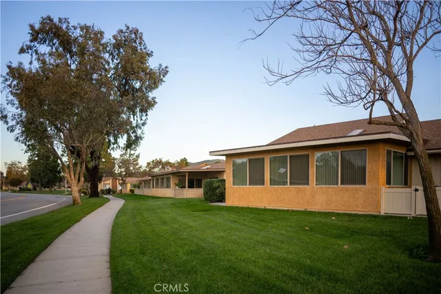 a view of a house with backyard