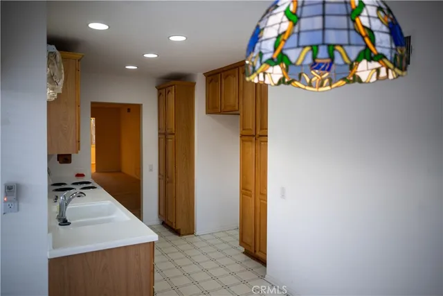 en suite bathroom with a sink mirror and vanity