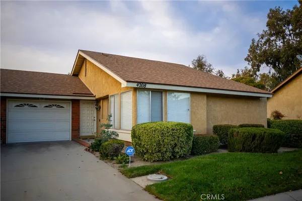 a view of a house with a garden