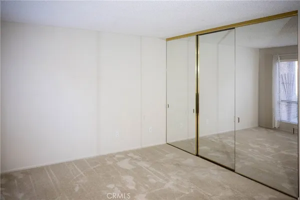 an empty room with sliding glass door