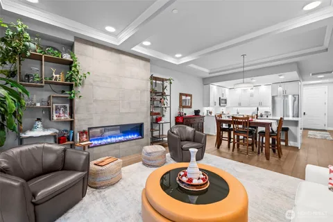 a living room with furniture and a dining table