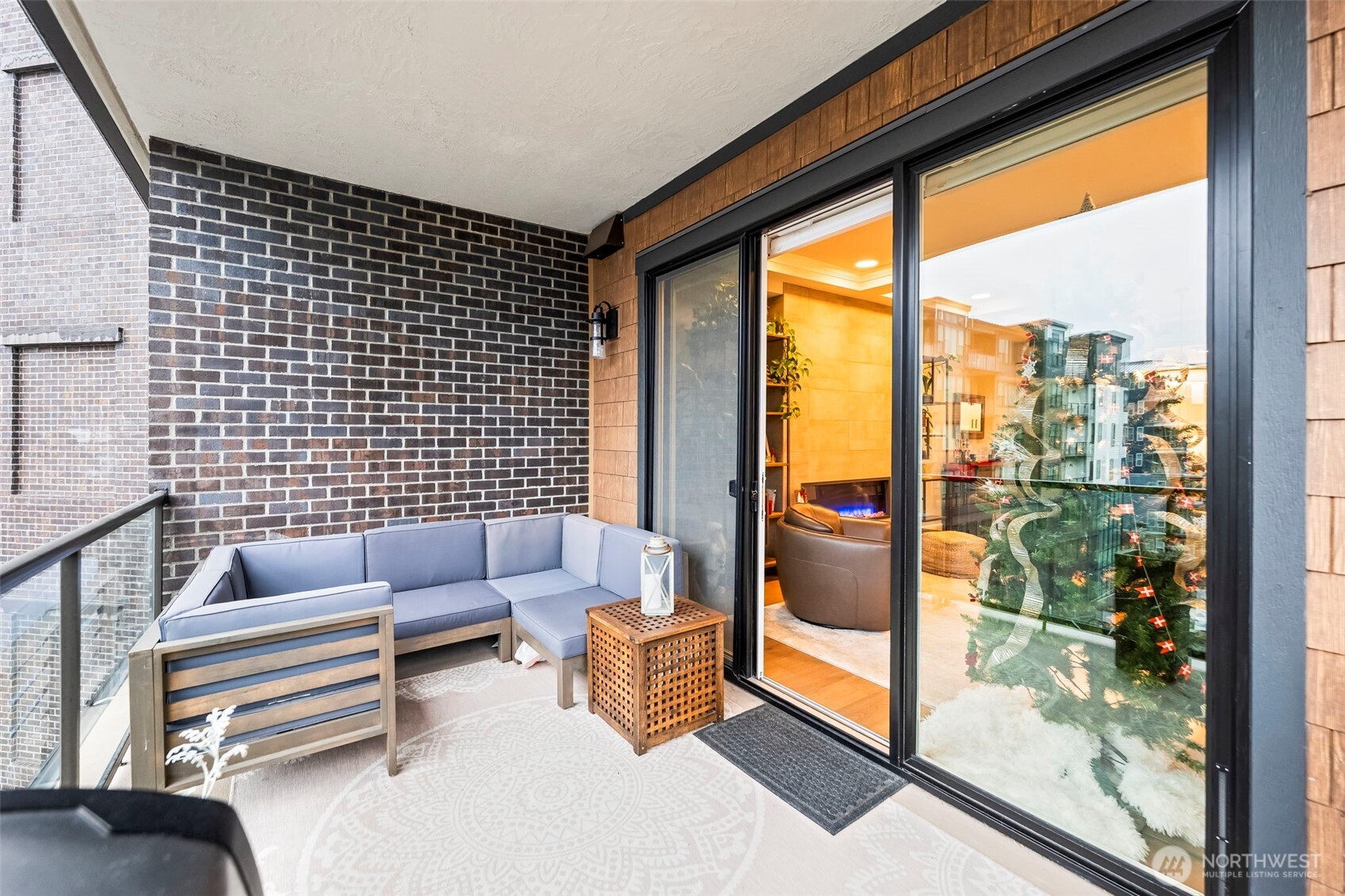 4907 Main Street, Unit 625 Tacoma, WA 98407 - Photo 13 of 40 a living room with furniture and a floor to ceiling window