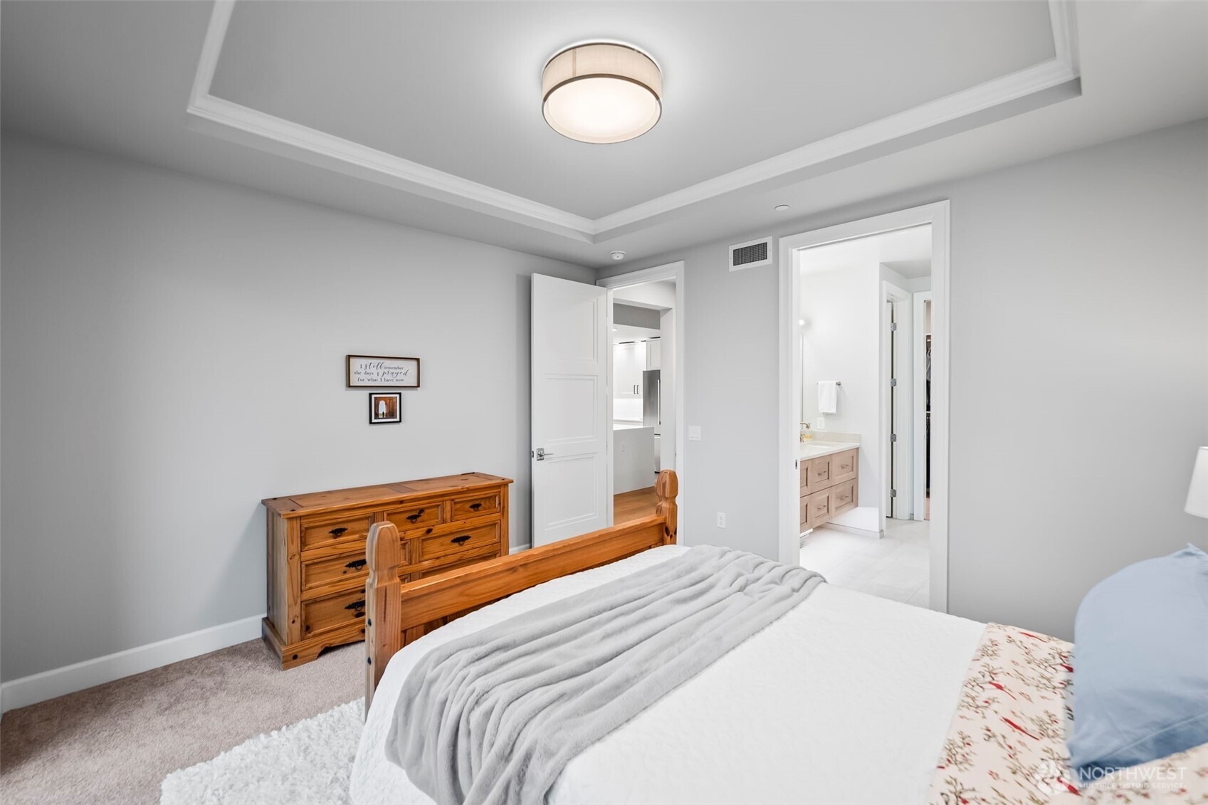 4907 Main Street, Unit 625 Tacoma, WA 98407 - Photo 15 of 40 a bedroom with a bed and a dresser