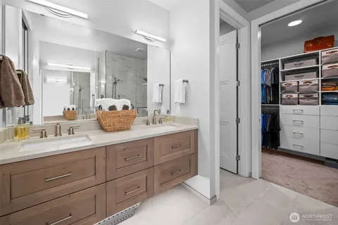 a spacious bathroom with a granite countertop sink mirror and double