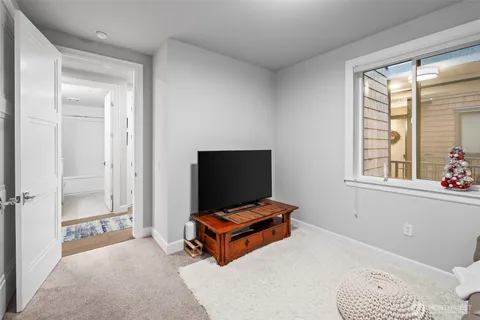 a living room with a couch and next to a window