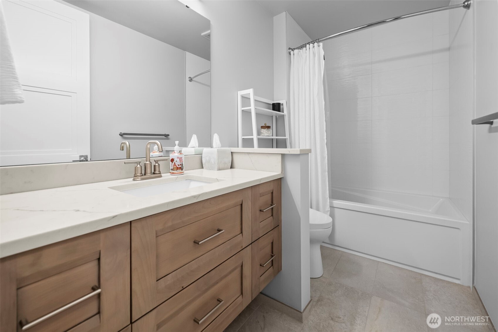 4907 Main Street, Unit 625 Tacoma, WA 98407 - Photo 24 of 40 a bathroom with a double vanity sink a mirror and a