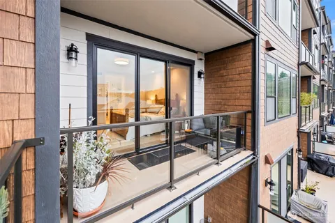 a view of a living room filled with furniture