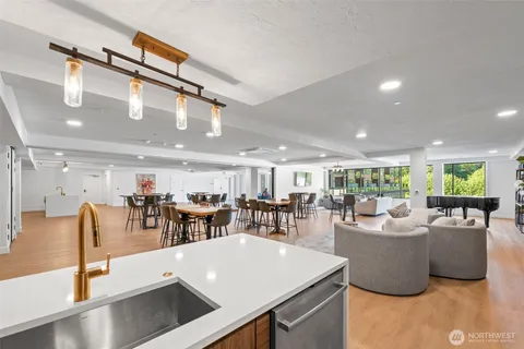 a view of a dining room with furniture and a large window