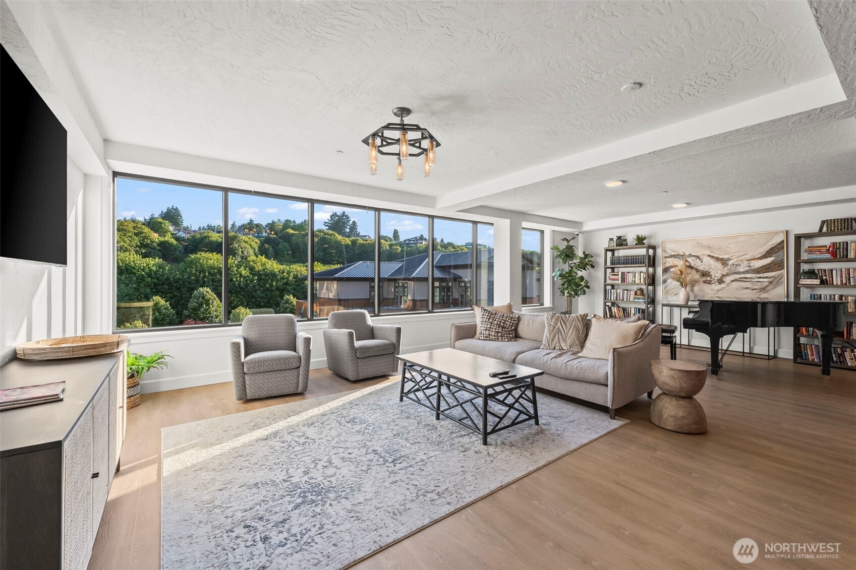 4907 Main Street, Unit 625 Tacoma, WA 98407 - Photo 33 of 40 a living room with furniture and a large window