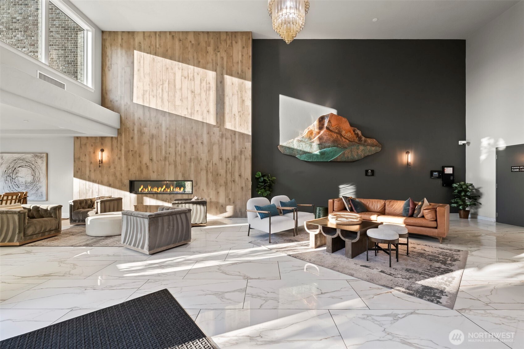 4907 Main Street, Unit 625 Tacoma, WA 98407 - Photo 36 of 40 a living room with furniture a rug and white walls