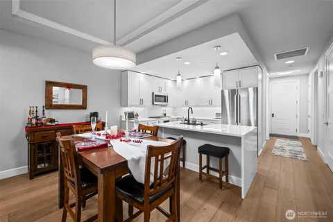 a large kitchen with a table and chairs
