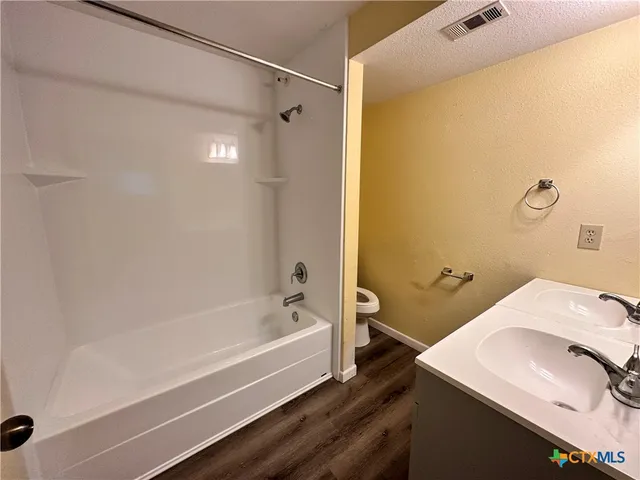 a bathroom with a sink and a bathtub