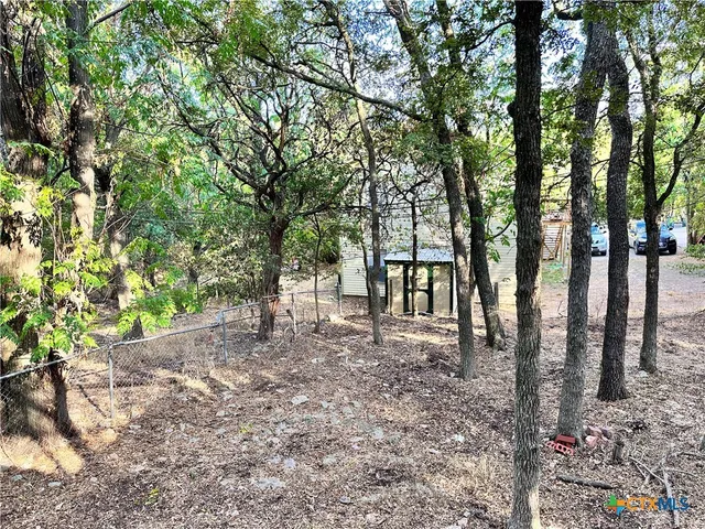 a view of outdoor space with lots of trees