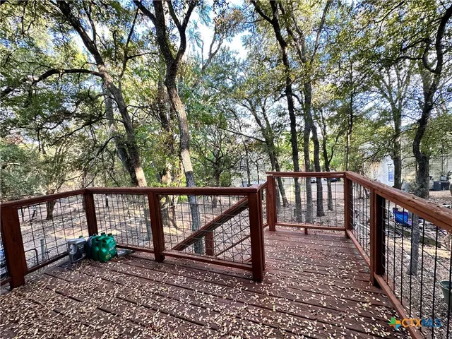 a view of a bench in a backyard