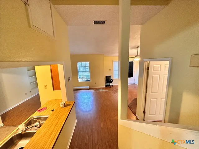 a view of a living room with a large window