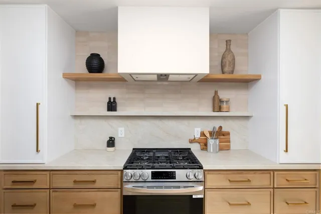 a kitchen with cabinets and appliances