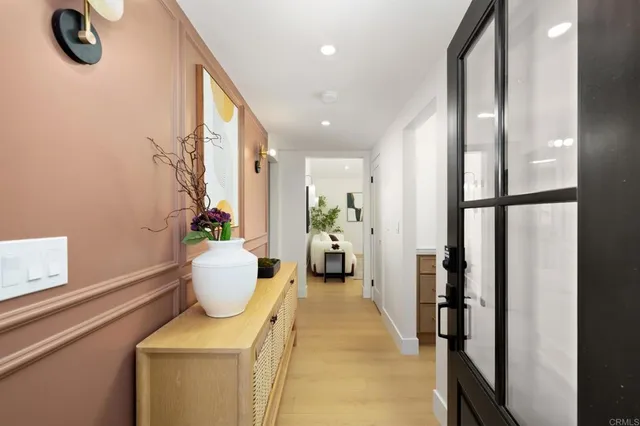 a bathroom with a toilet and a mirror