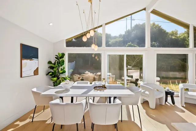 a view of a dining room with furniture window and outside view