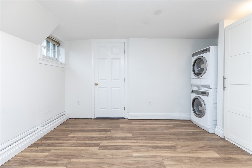 440 Adams Street, Unit 1 Boston, MA 02122 - Photo 12 of 18 a view of a storage & utility room with washer and dryer