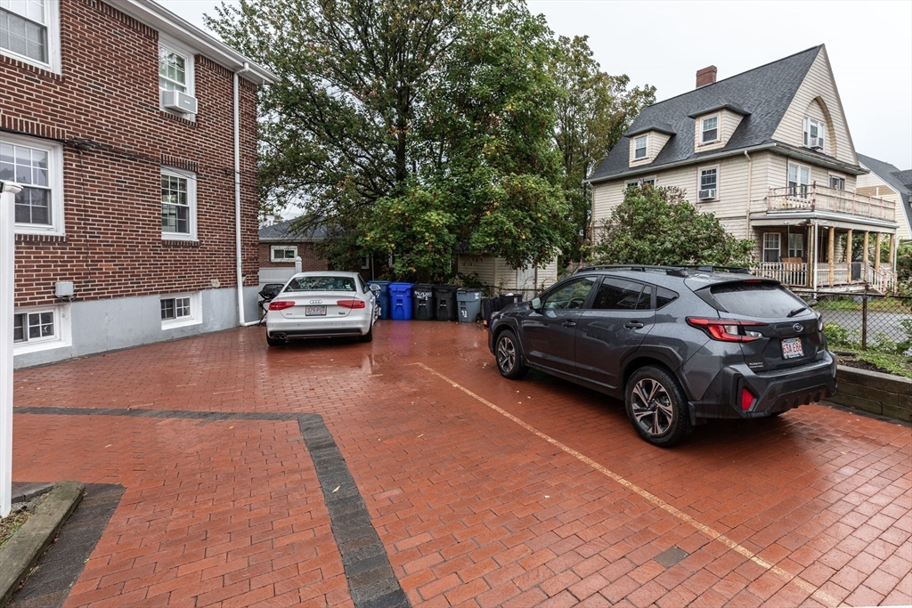 440 Adams Street, Unit 1 Boston, MA 02122 - Photo 16 of 18 a car parked in front of a house