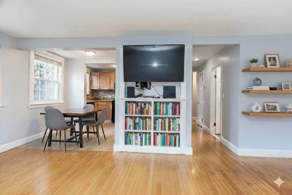 440 Adams Street, Unit 1 Boston, MA 02122 - Photo 3 of 18 a living room with furniture and a flat screen tv