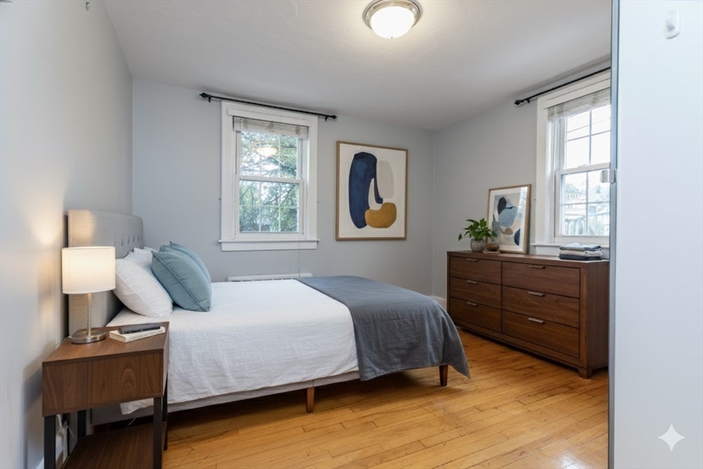 440 Adams Street, Unit 1 Boston, MA 02122 - Photo 4 of 18 a bedroom with a bed and window