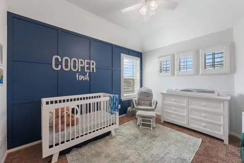 a bedroom with furniture and a window